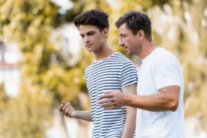 young man talking to his mentor